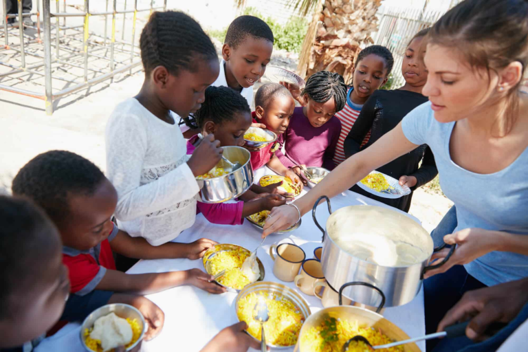 who-wants-sauce-cropped-shot-of-children-getting-2023-11-27-05-29-37-utc.webp